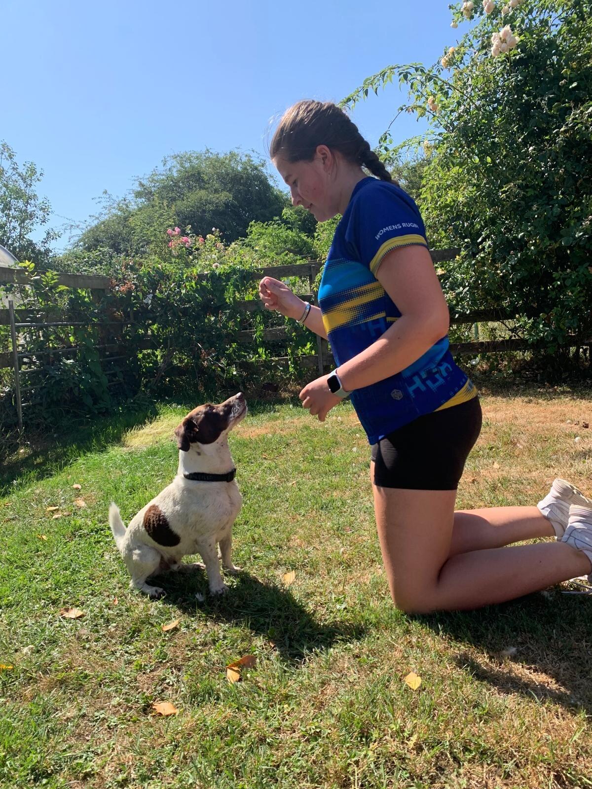Freya working with a dog outdoors
